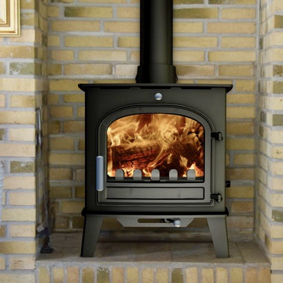 Norresk single door wood burning stove lit and burning brightly